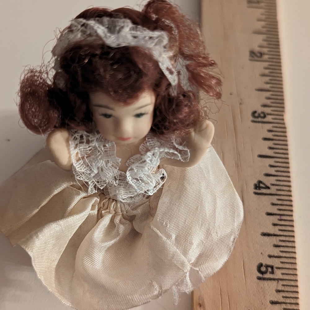 Miniature vintage bisque doll